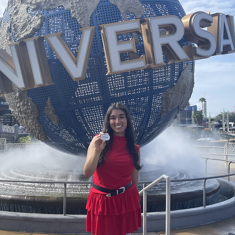Jasmin Ali-Diaz poses in front of Universal Studios in Orlando, Florida